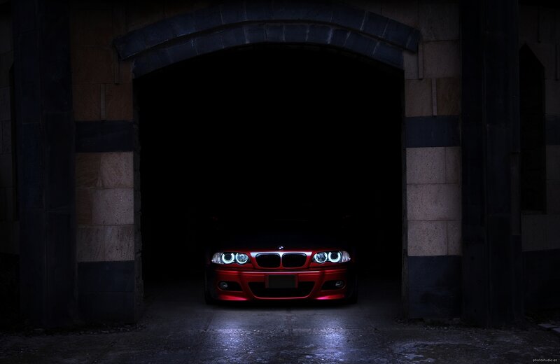 Red car in dark garage