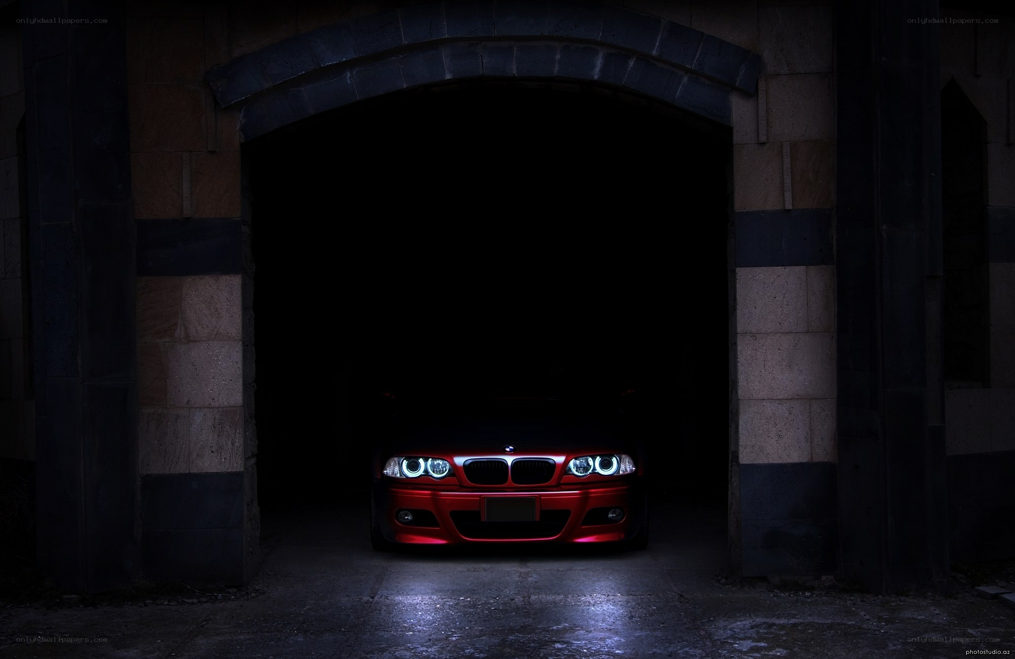 Red car in dark garage