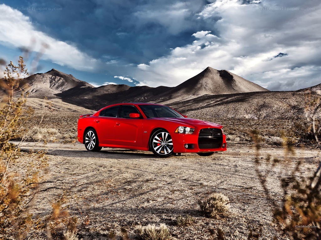 Red car in desert landscape