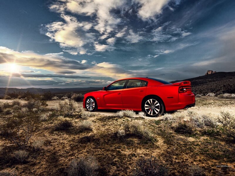 Red car in desert landscape