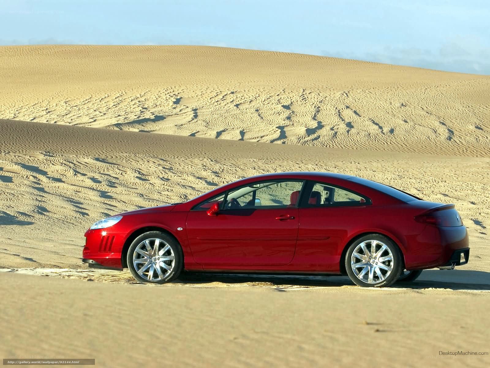 Red car in desert landscape