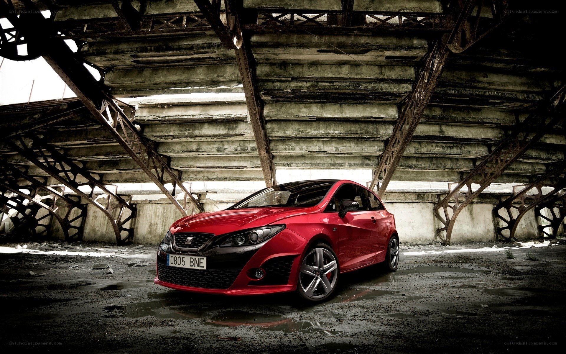 Red car in industrial setting
