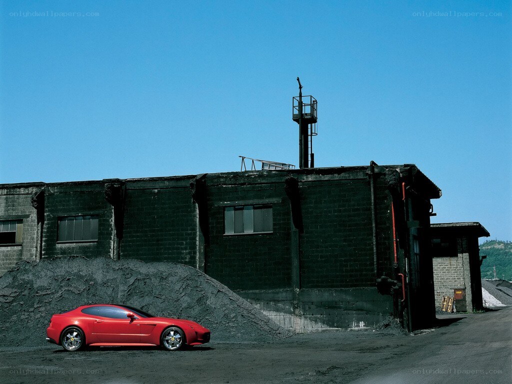 Red car in industrial setting