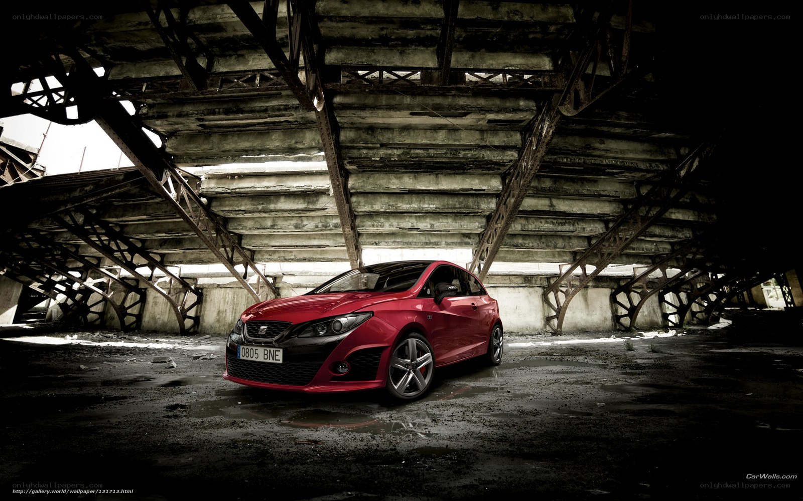 Red car in industrial setting