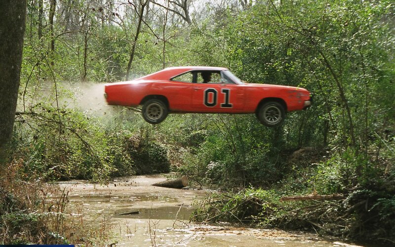 Red Car in Mid-air — Dramatic, Afternoon