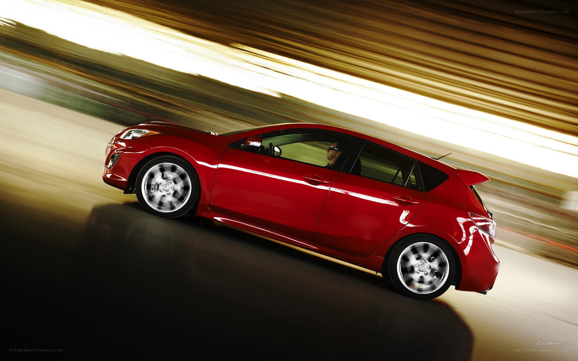 red car in motion