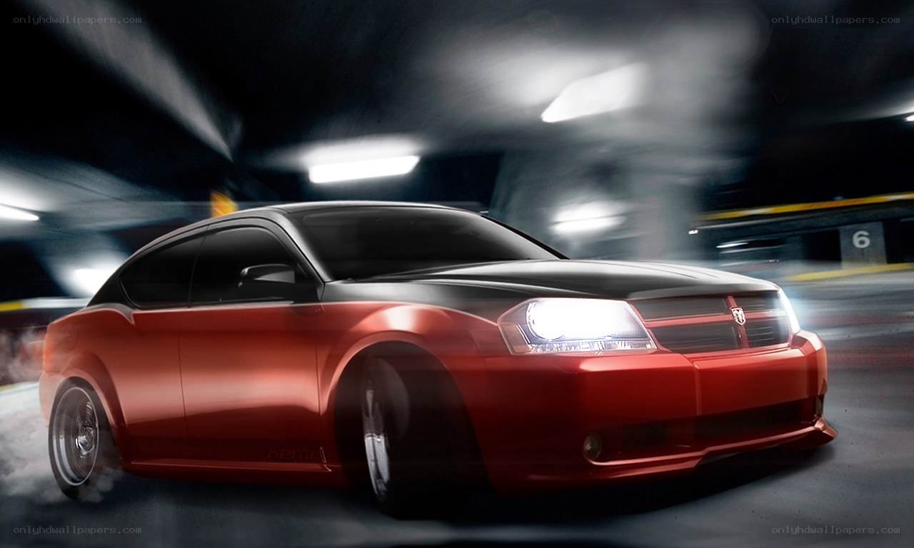 Red car in motion at night
