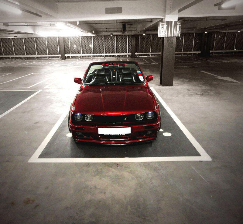 Red Car in Parking Garage — Dramatic