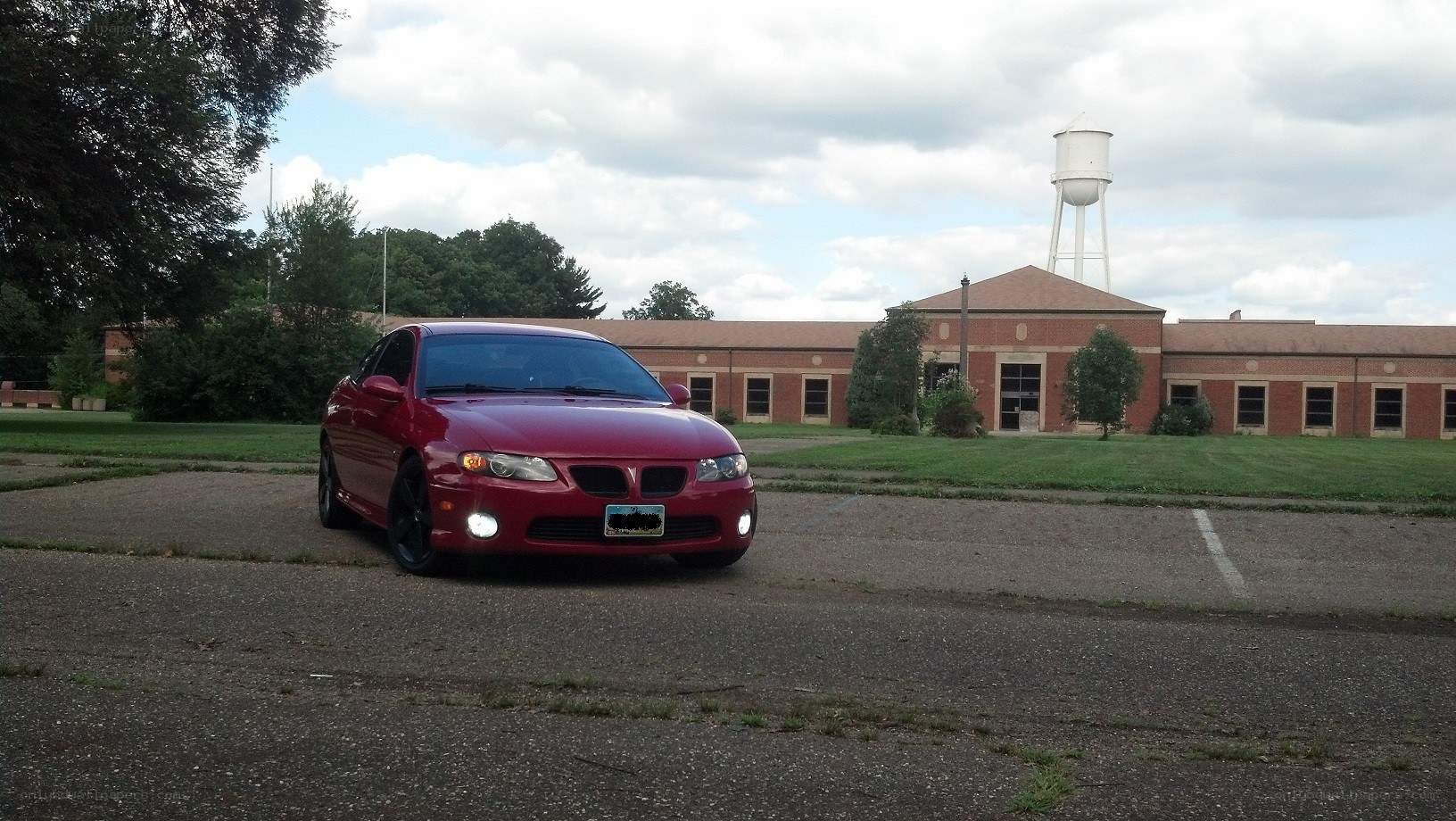 Red car in parking lot