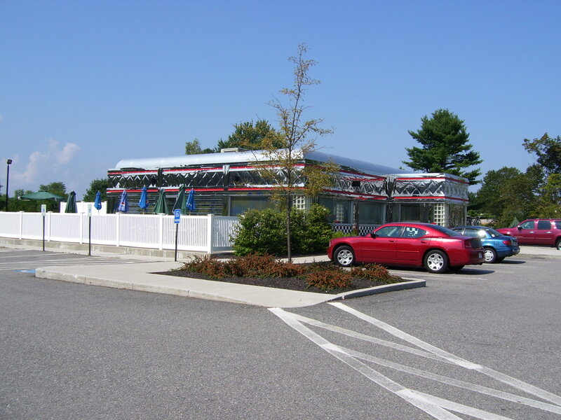 Red Car in Parking Lot — Gray