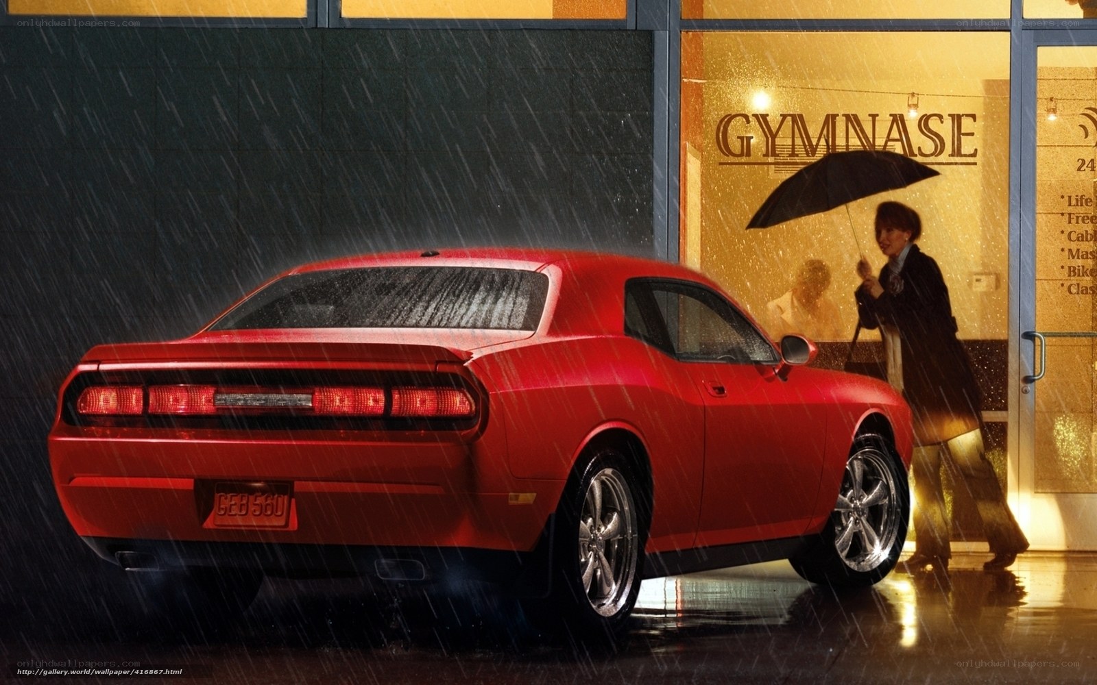 Red car in rainy city