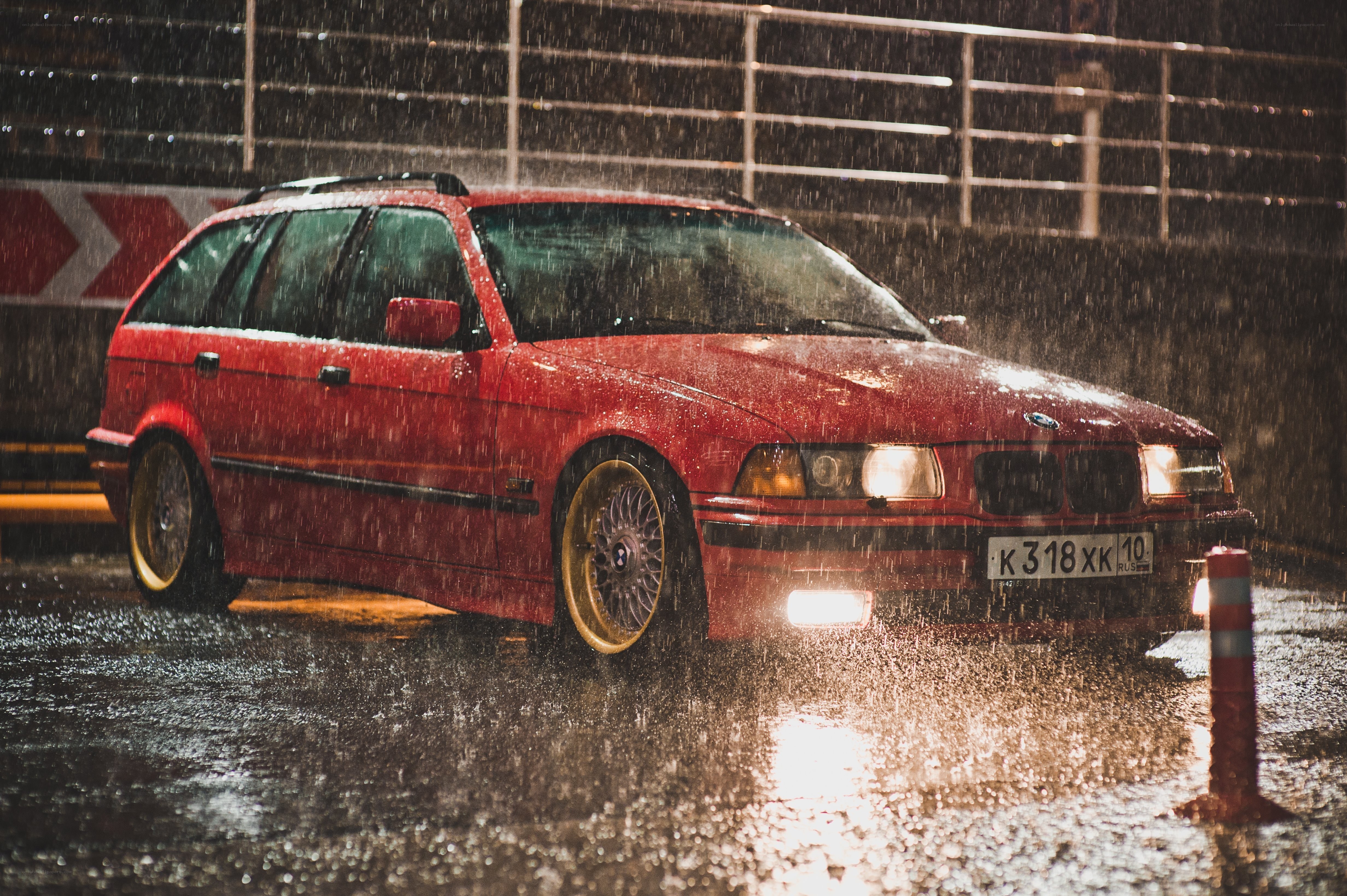 Red car in rainy night