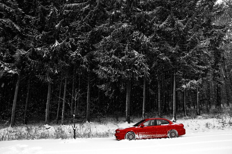 Red Car in Snow — Dramatic