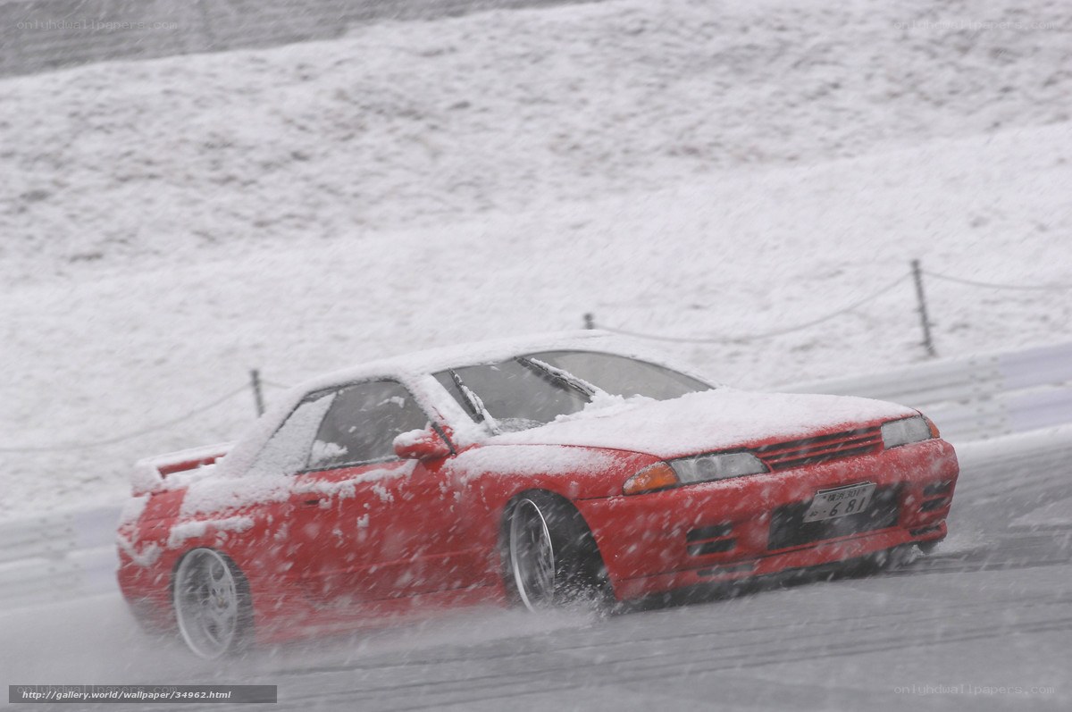 Red car in snowy drift