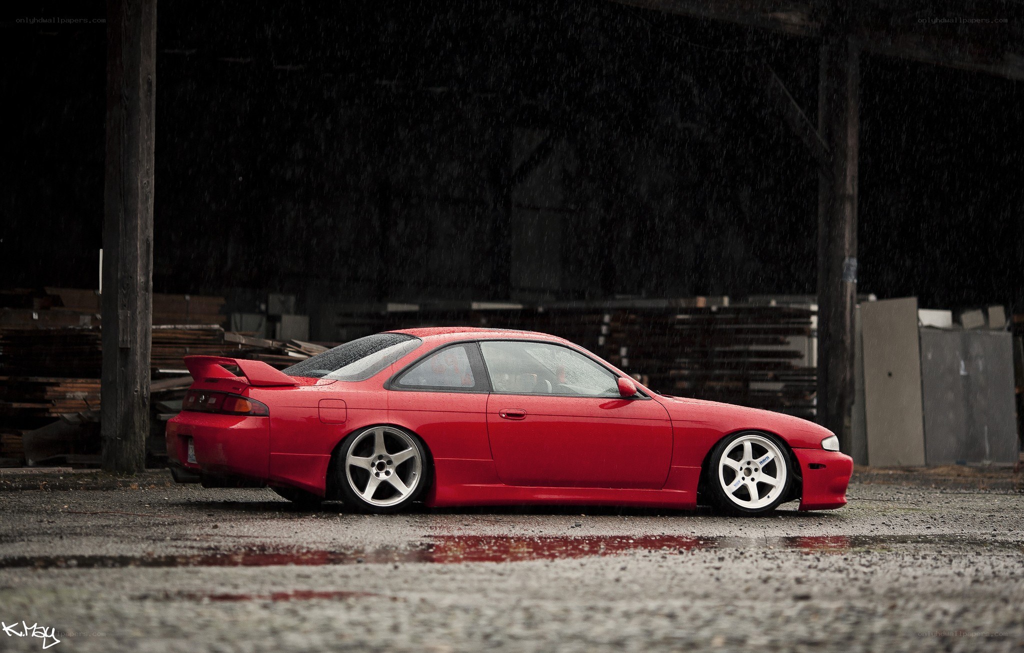 Red car in the rain