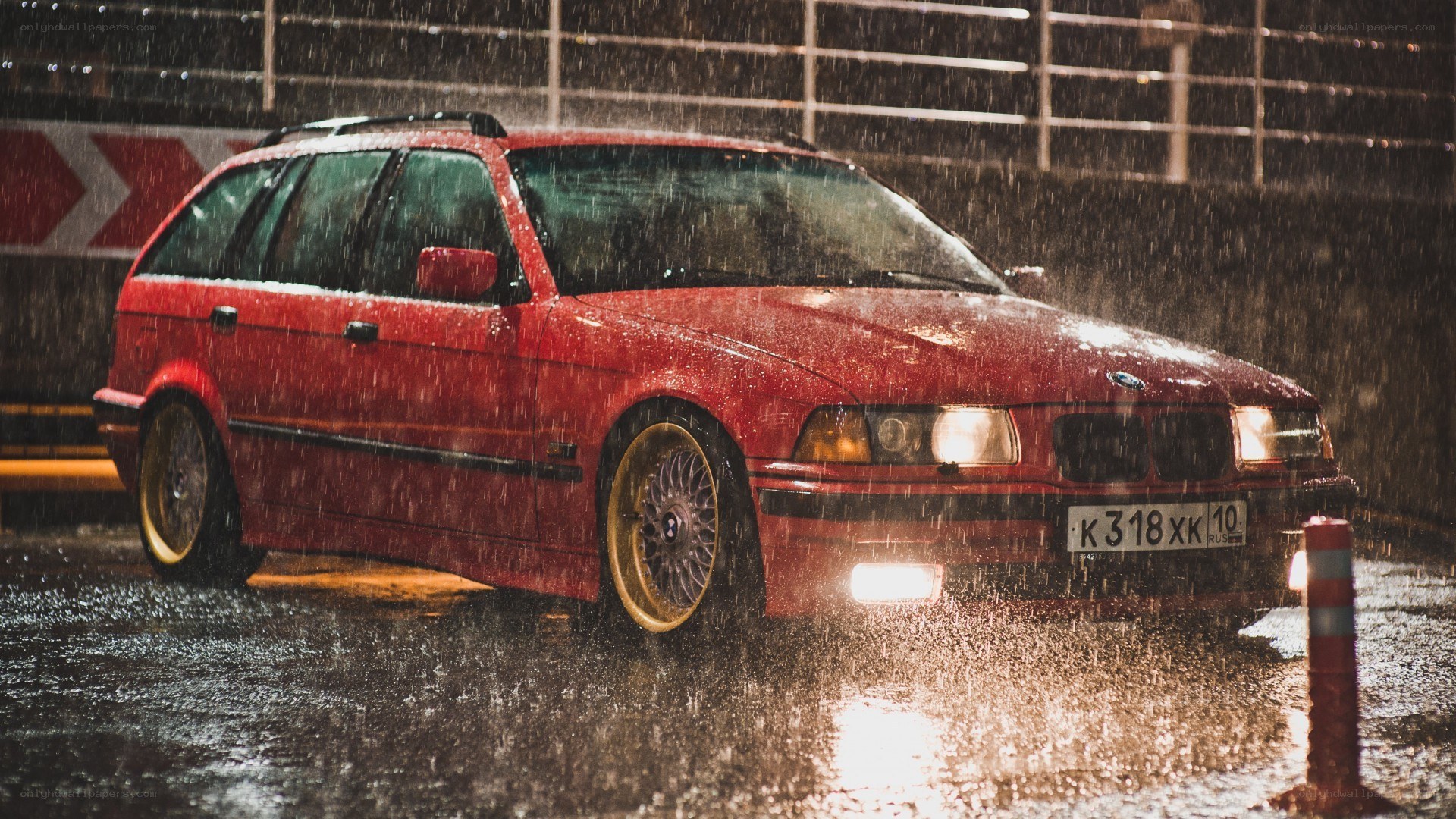 Red car in the rain