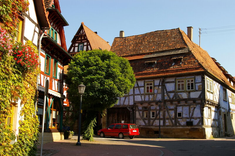 Red Car in Town Square