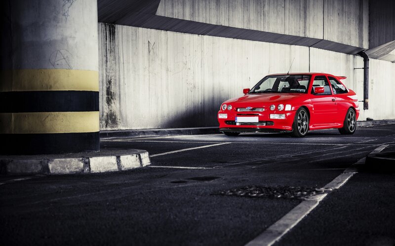 Red car in underground parking