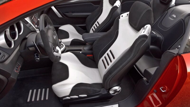 red car interior with black and white seats