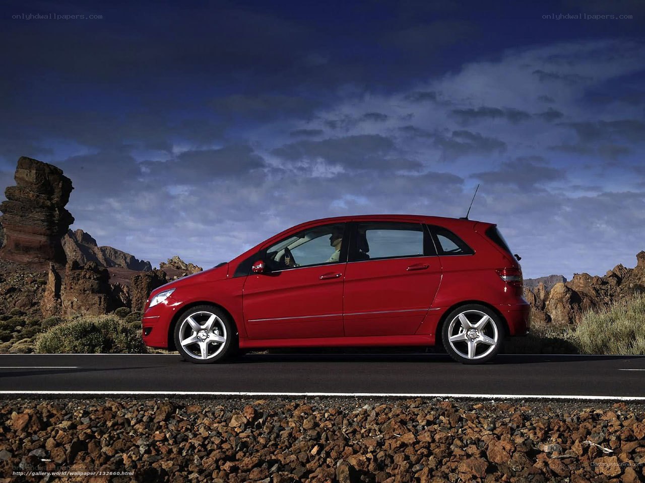 Red car on a desert road
