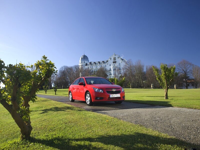 Red car on a driveway