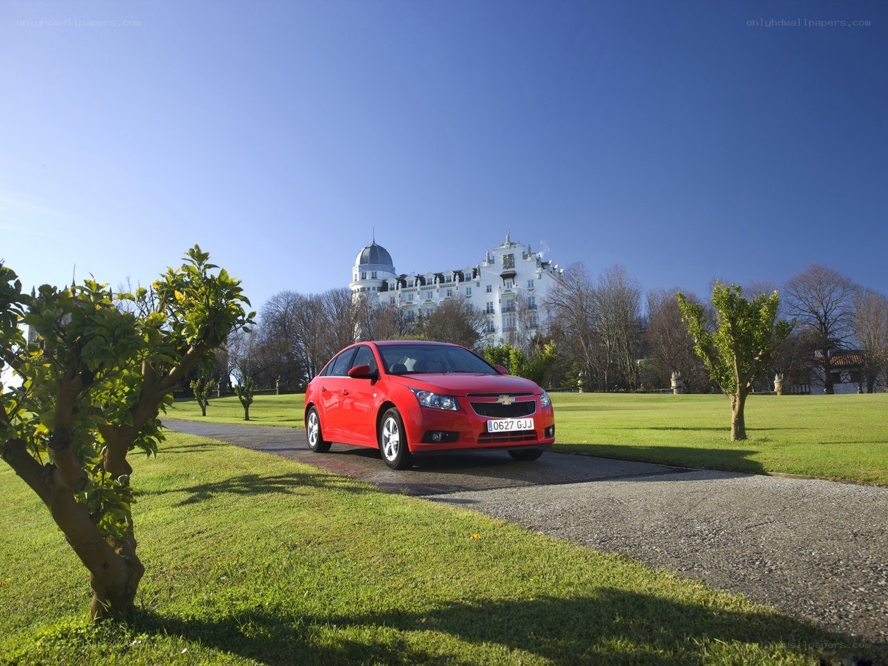 Red car on a driveway