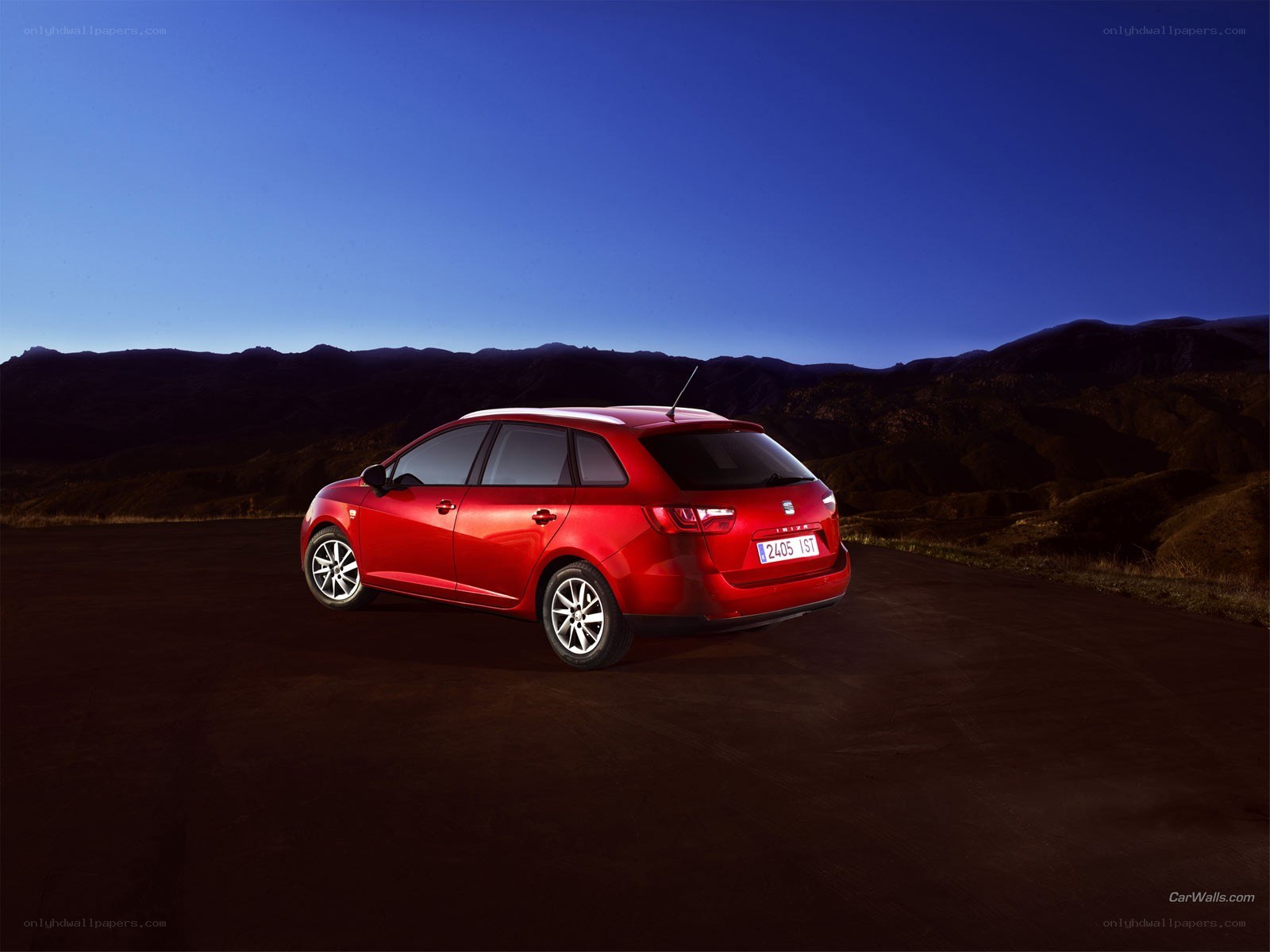 Red car on a mountain road