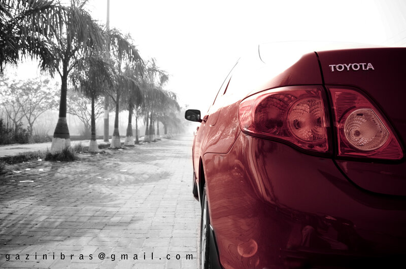 Red car on a quiet street