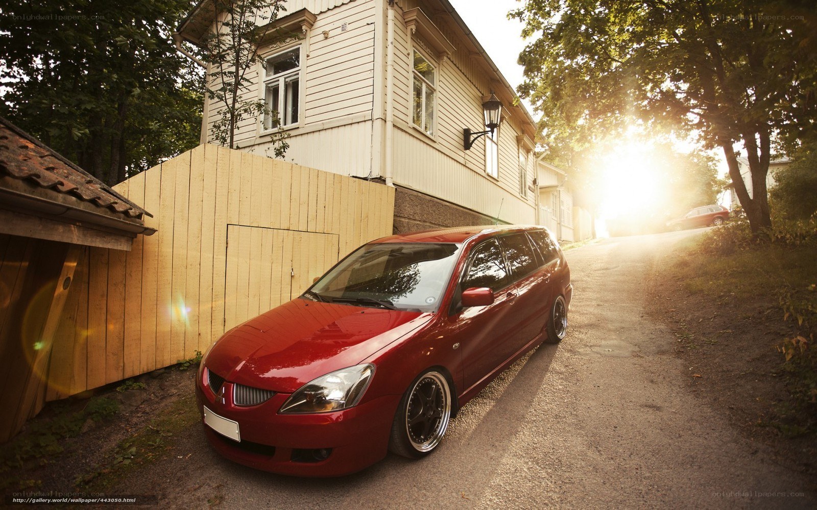Red car on a quiet street