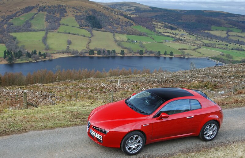 Red car on a scenic road