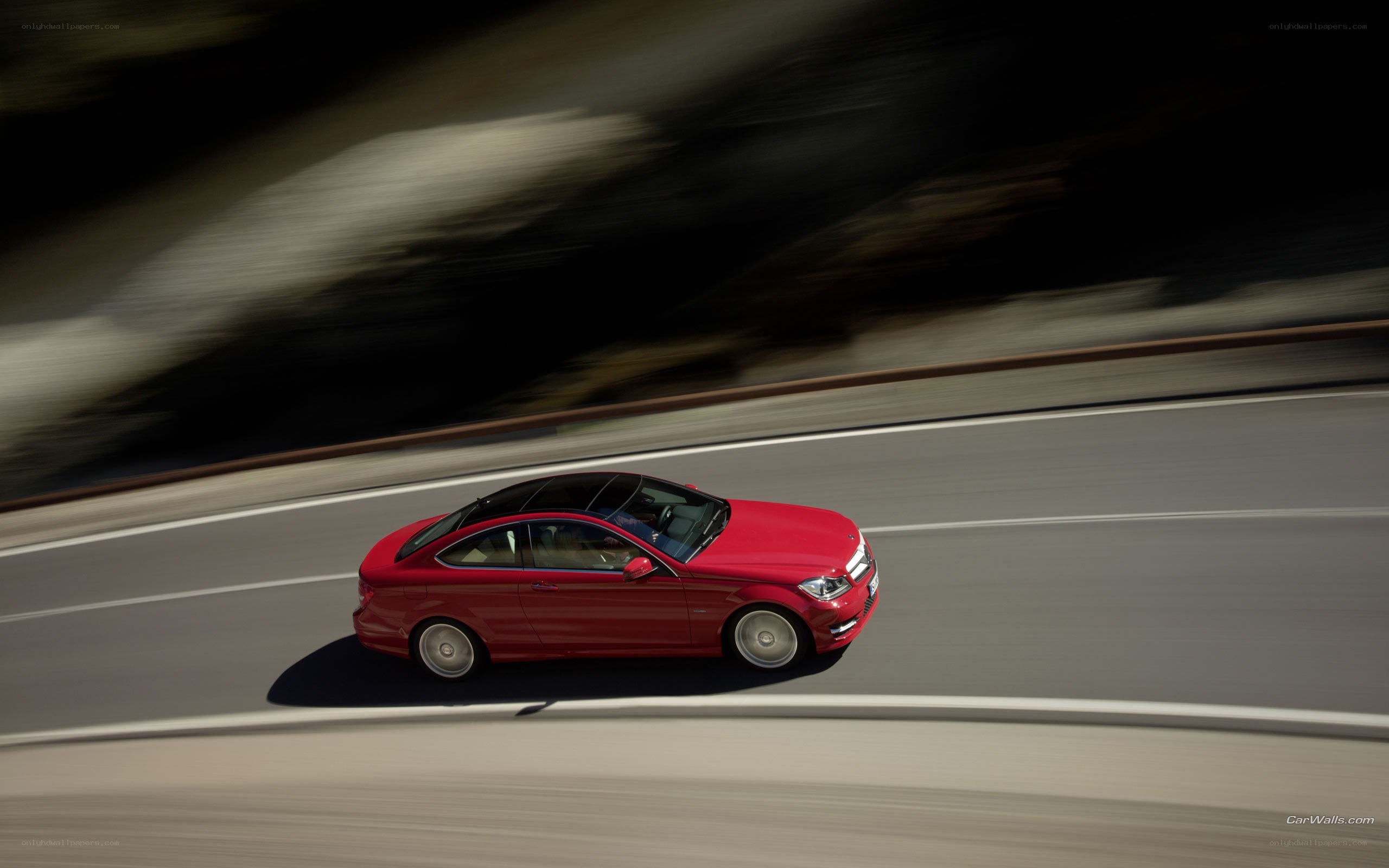Red car on a winding road