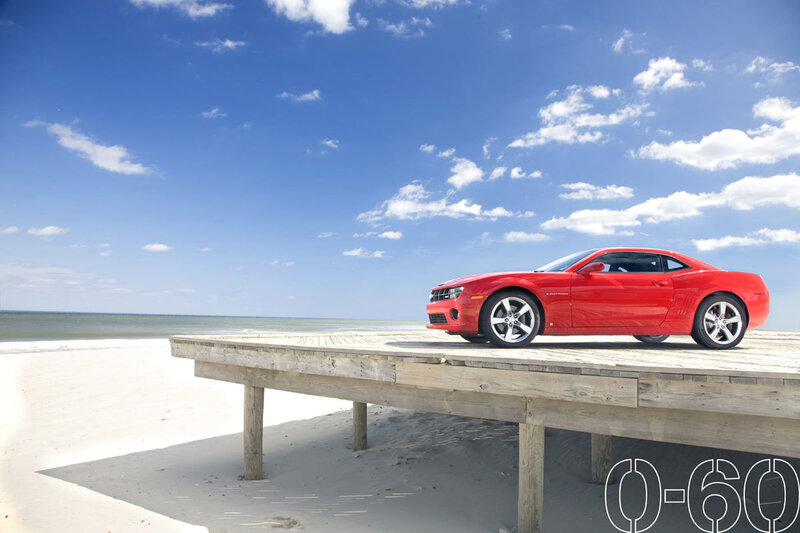 Red car on beach pier