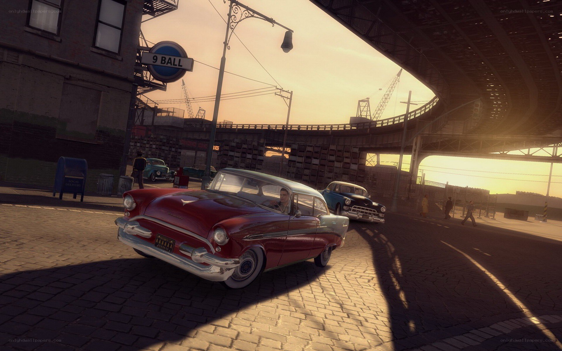Red car on cobblestone street