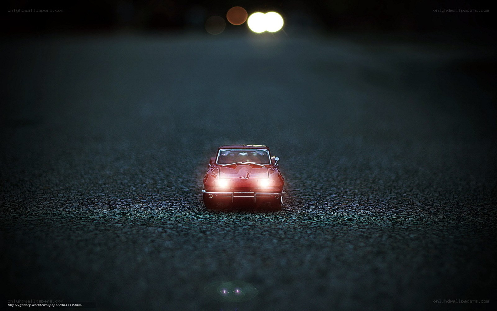 Red car on dark road