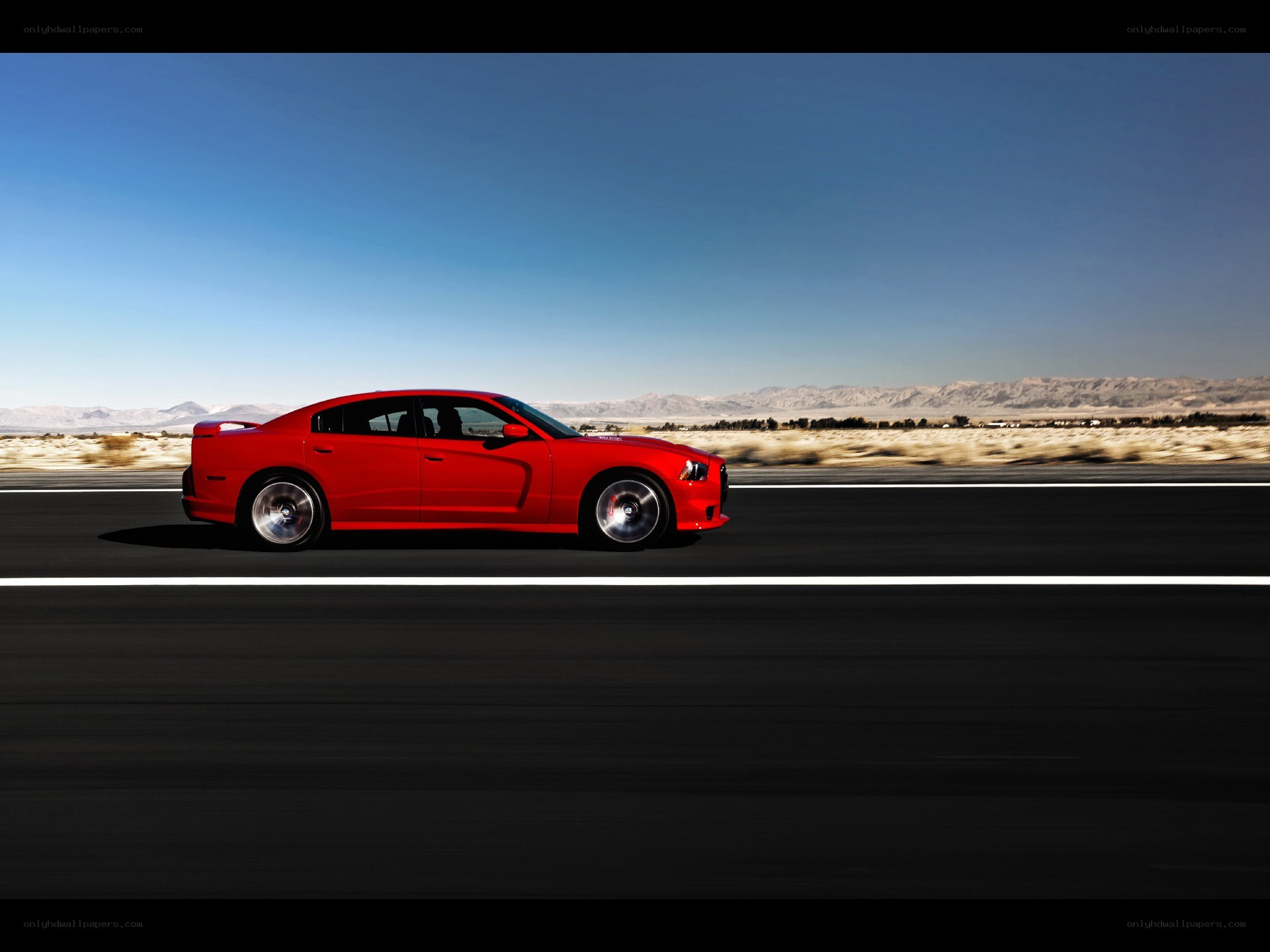 Red car on desert highway