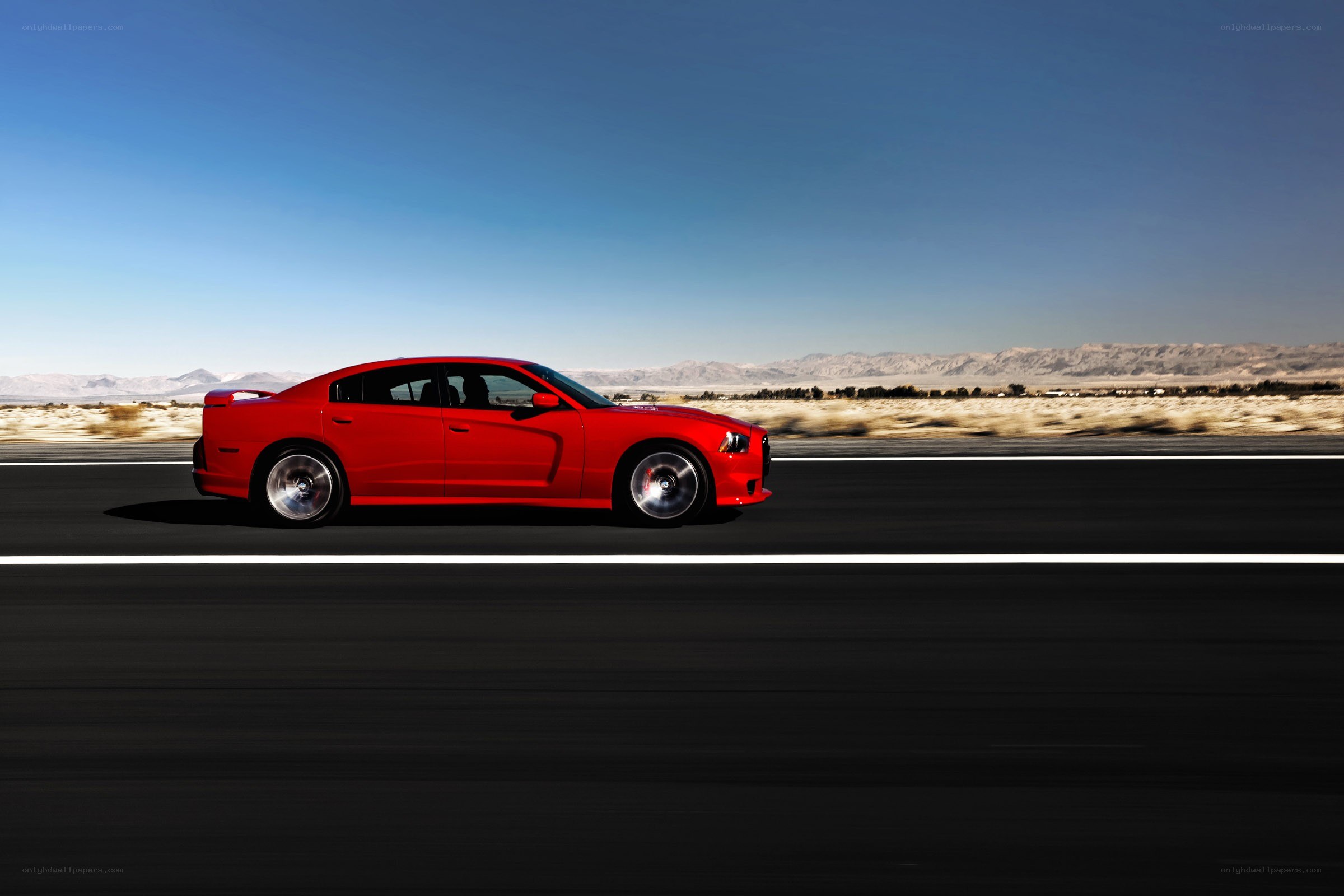 Red car on desert highway