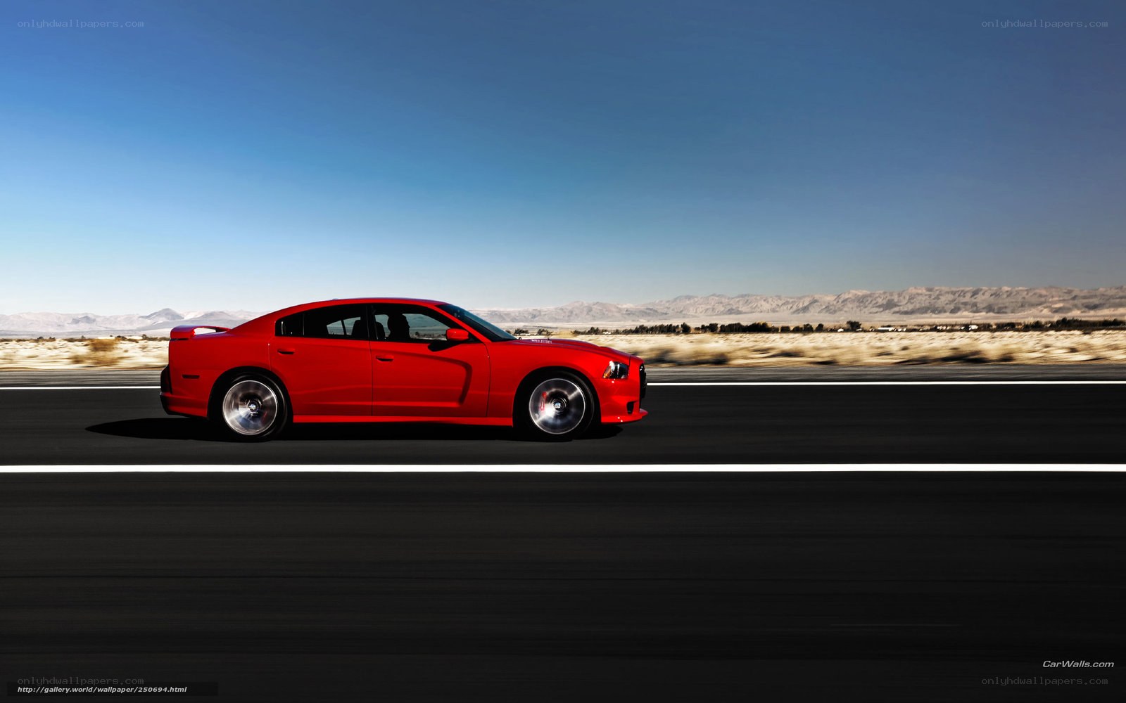 Red car on desert highway