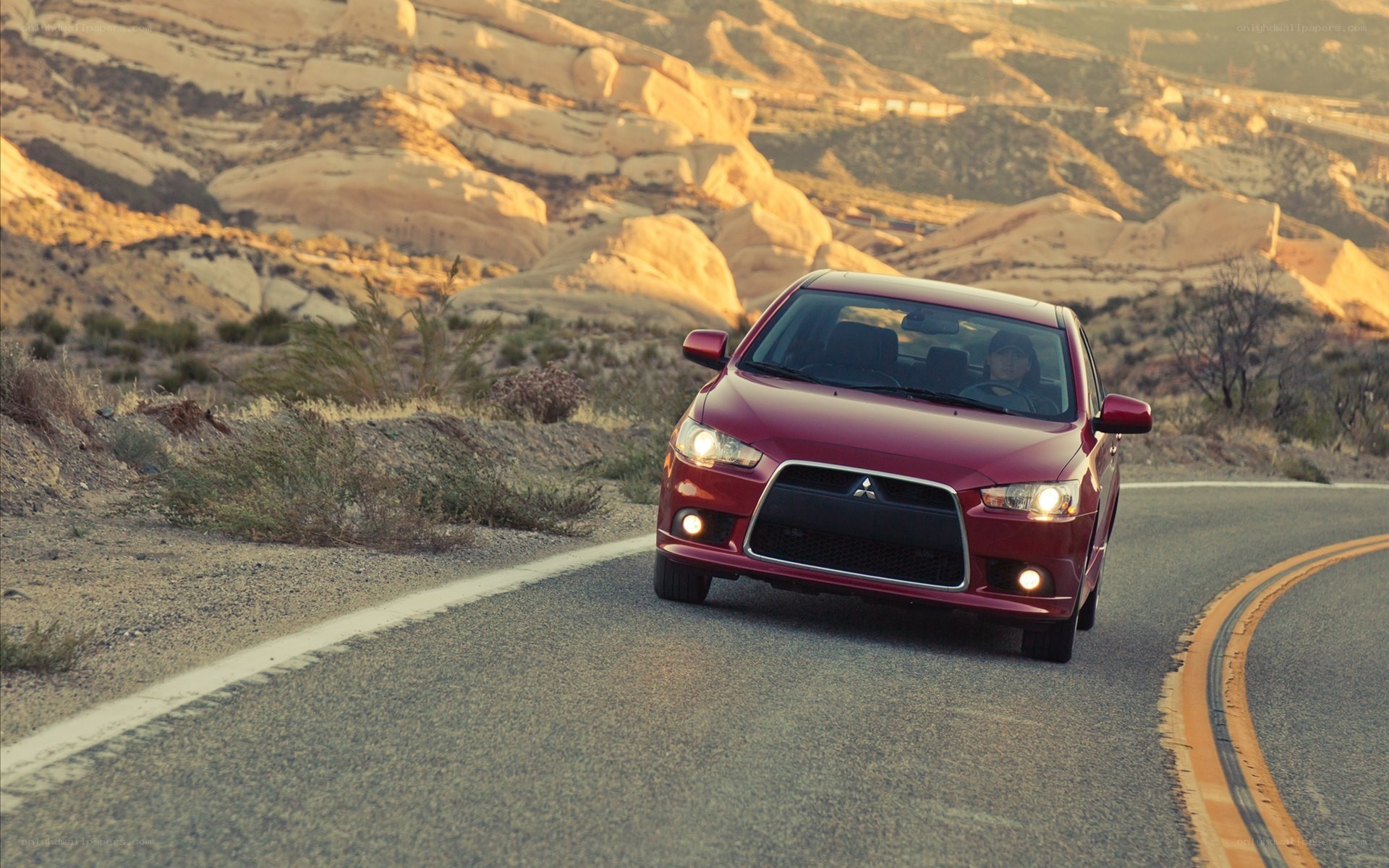 Red car on desert road