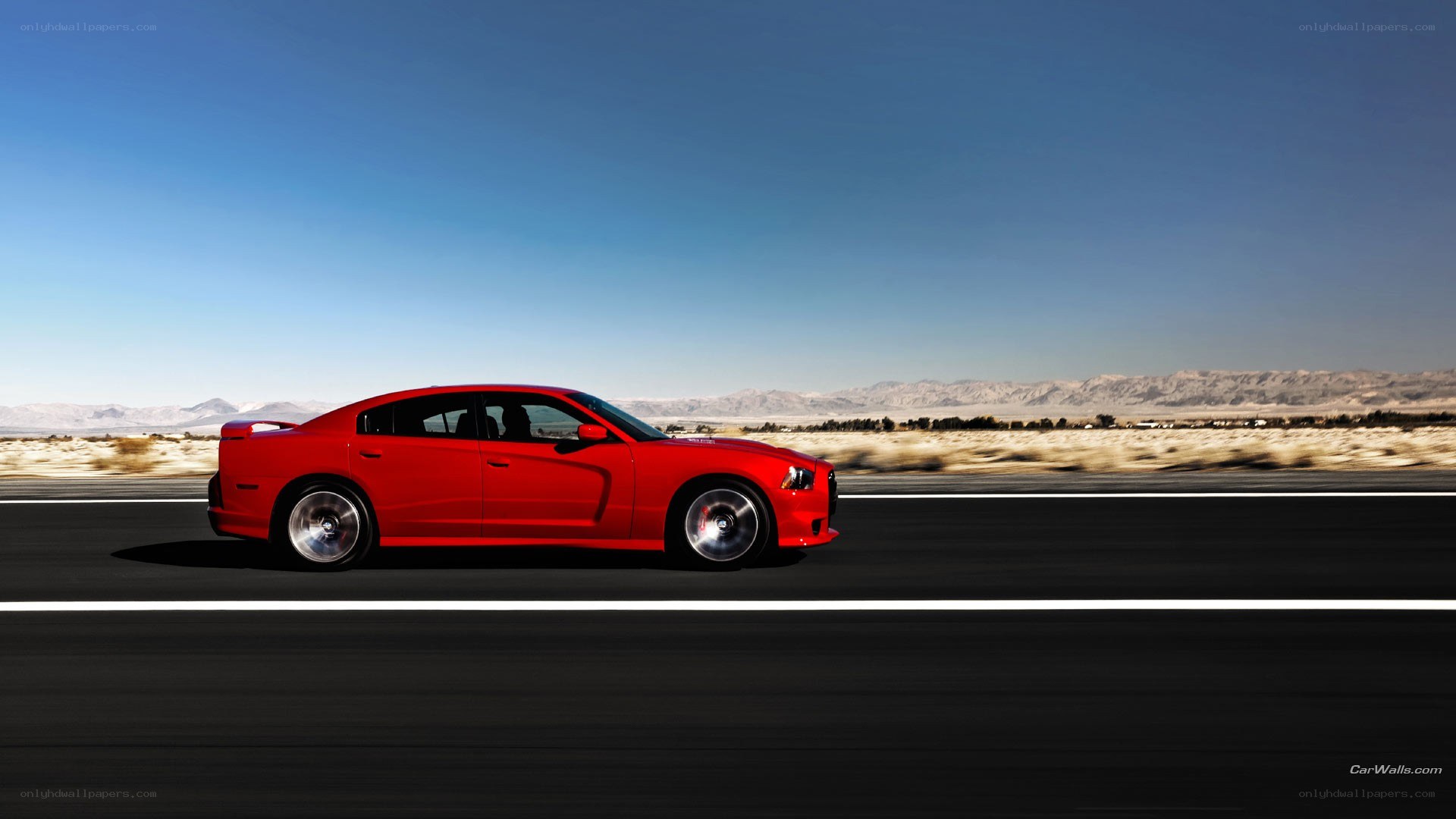 red car on desert road