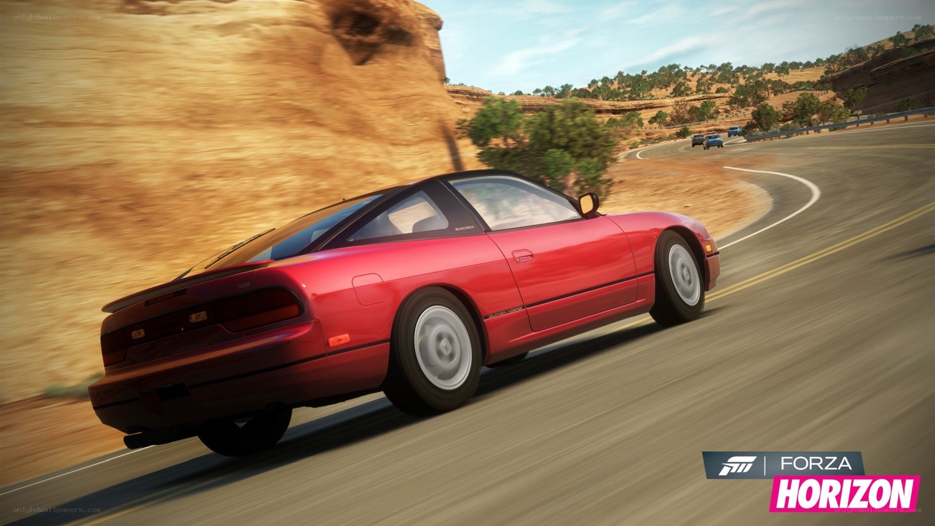 red car on desert road