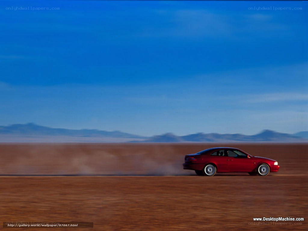 Red car on desert road