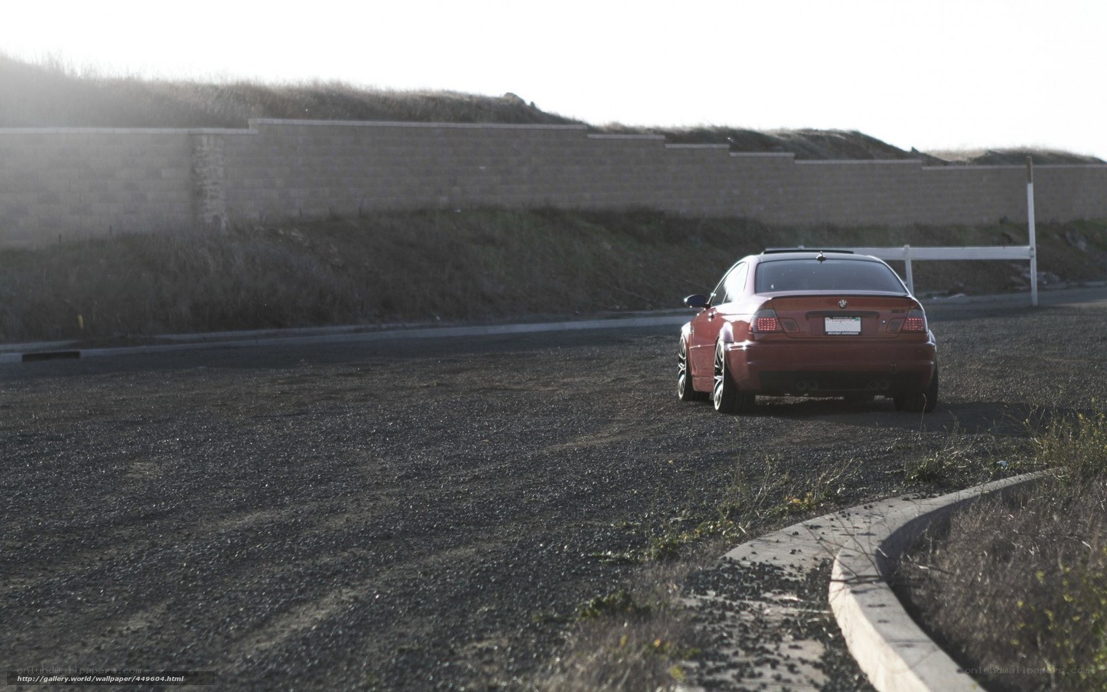 red car on gravel road