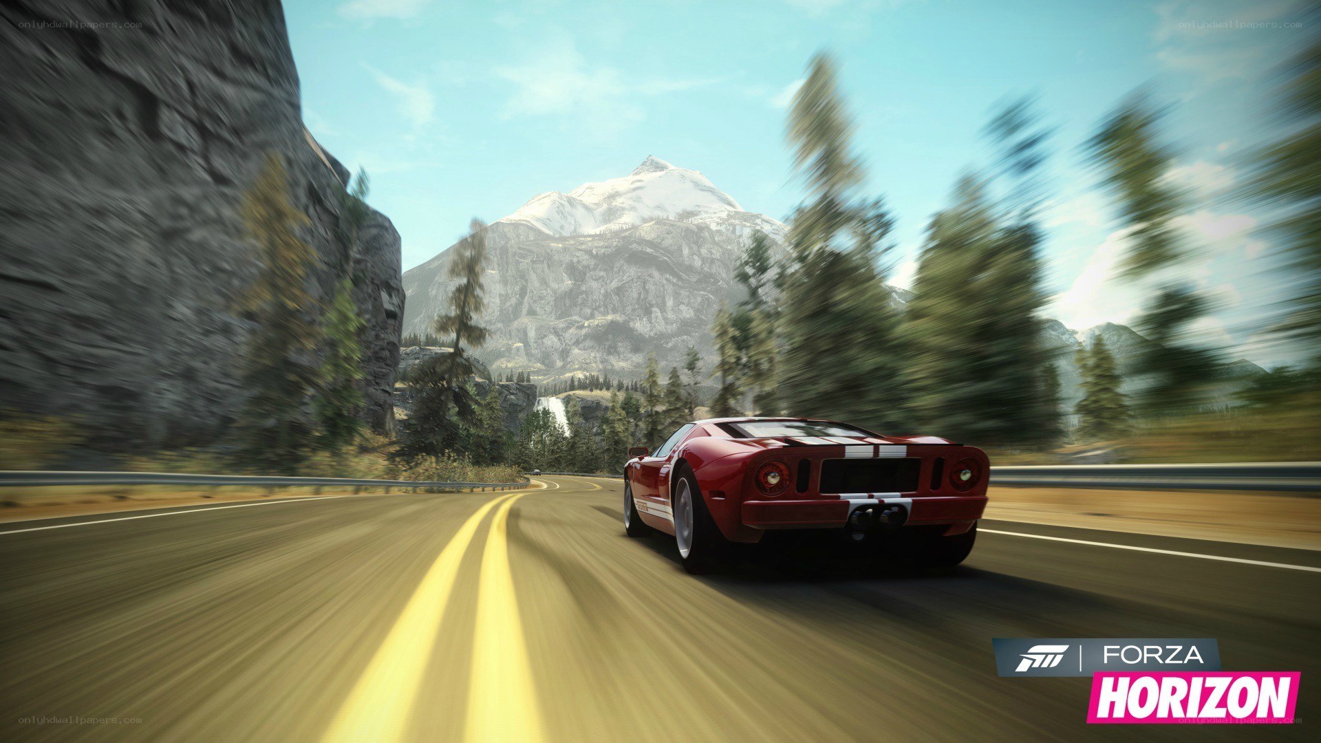 Red car on mountain road