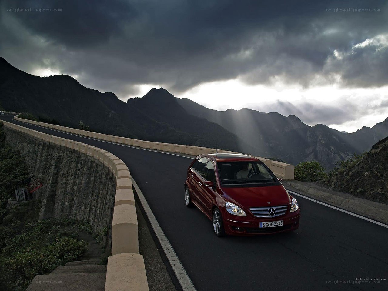 Red car on mountain road