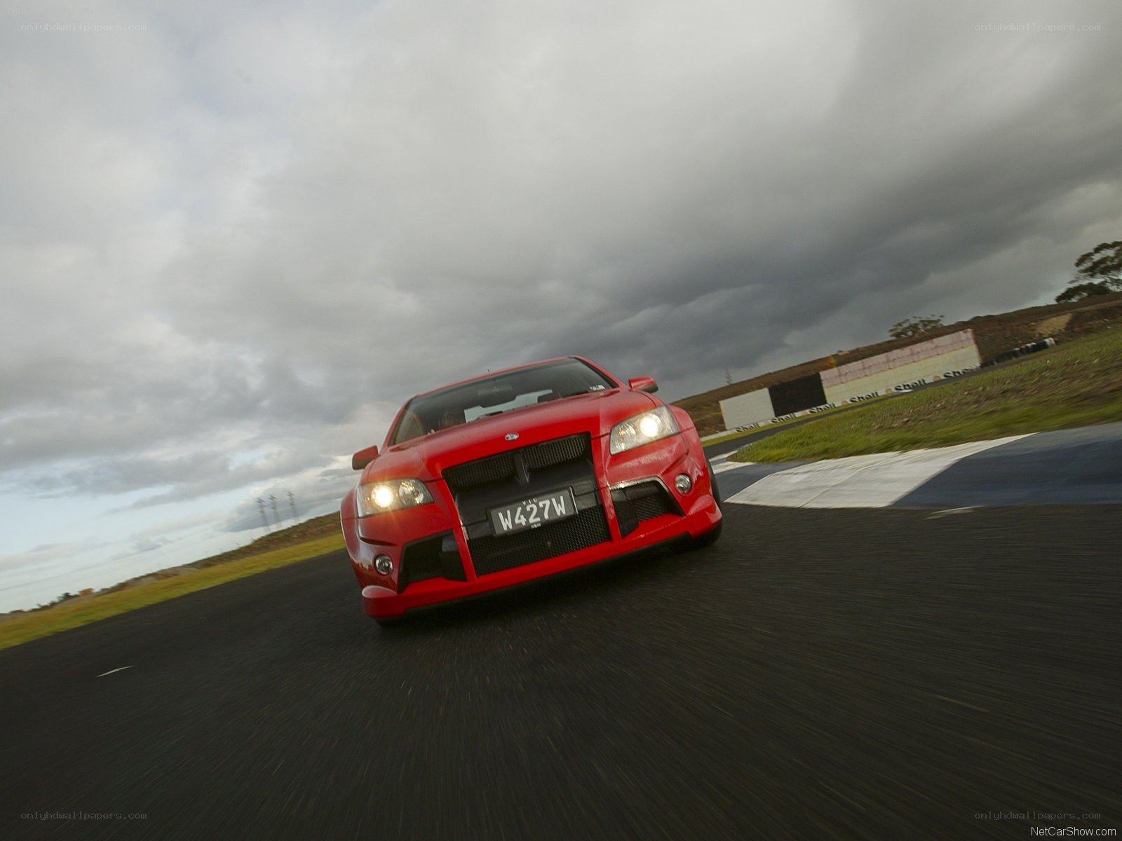 red car on racetrack