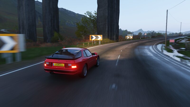 Red Car on Road — Calm, Morning