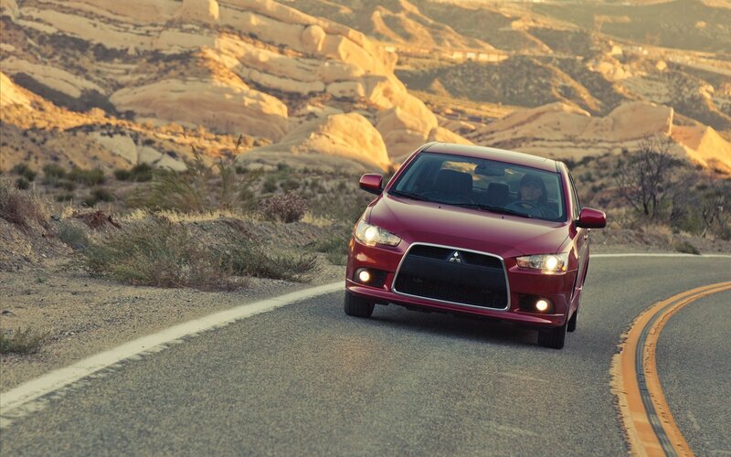 Red Car on Road — Dramatic, Sunset
