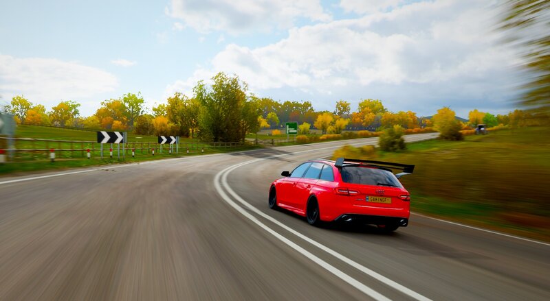Red Car on Road — Dynamic, Autumn