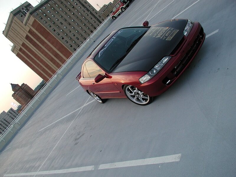 red car on rooftop parking