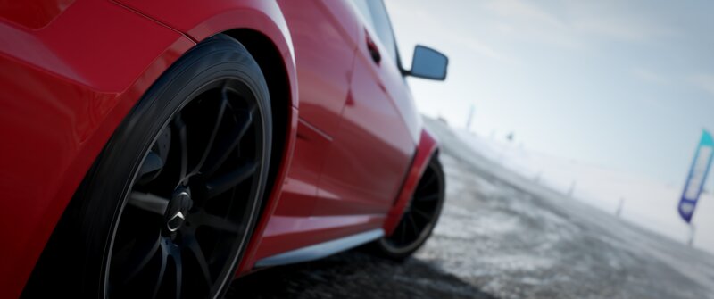 Red Car on Snowy Road — Cold, Focused